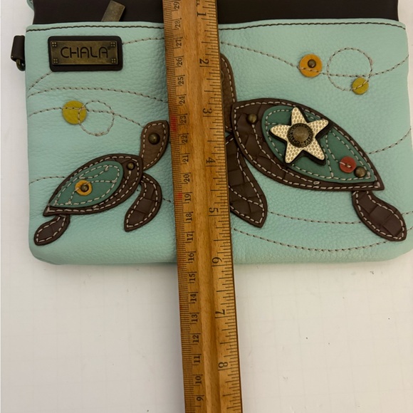 Chala Mini Crossbody bag featuring a sea turtle design. - Picture 4 of 8